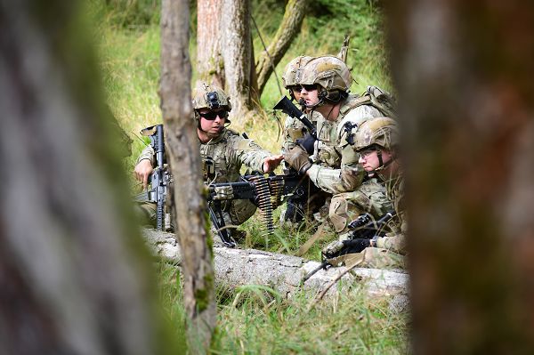 U.S. Army Sgt. William Peters, a Team Leader assigned to HHT, 2nd Squadron, 2nd Cavalry Regiment, directs his troops while conducting a scout section live fire exercise at the Grafenwoehr Training Area, Germany, Oct. 05, 2023. 2nd Cavalry Regiment provides V Corps, America’s forward-deployed corps in Europe, with combat-credible forces capable of rapid deployment throughout the European theater to defend the NATO alliance. (U.S. Army photo by Kevin Sterling Payne)