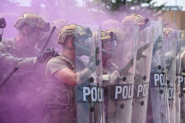 Air National Guard Airmen from the 185th Air Refueling Wing Security Forces Squadron form a shield wall amid smoke during domestic operations training at the 185th Air Refueling Wing in Sioux City, Iowa, June 4, 2023. During the training, the security forces Airmen trained with shields, batons and smoke grenades. (U.S. Air National Guard photo by Senior Airman Tylon Chapman)