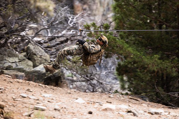 A U.S. Marine with 1st Battalion, 1st Marine Regiment, 1st Marine Division, uses a zipline to cross a canyon during Mountain Training Exercise 5-23 at Marine Corps Mountain Warfare Training Center Bridgeport, California, Aug. 18, 2023. MTX gives Marines the opportunity to hone their combat and survival skills in an austere mountain environment. (U.S. Marine Corps photo by Lance Cpl. Juan Torres)