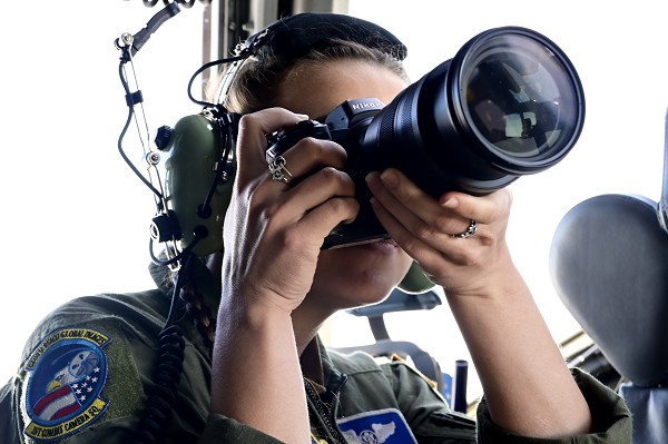 Airman 1st Class Natalie Vandergriff, aerial combat camera journeyman assigned to the 1st Combat Camera Squadron, documents a mobility force training mission over Charleston, S.C., March 13, 2023. The squadron acquires still and motion imagery in support of classified and unclassified air, sea and ground military operations as a fundamental tool of commanders and decision-makers throughout the Department of Defense. (U.S. Air Force photo by Master Sgt. Matthew Plew)