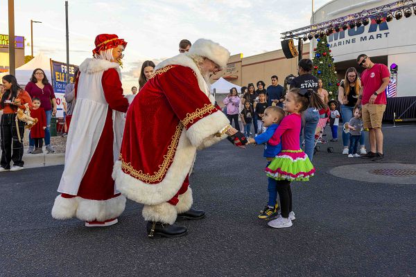 Families participate during the annual Christmas tree lighting ceremony at Marine Corps Air Station (MCAS) Yuma, Arizona, Nov. 17, 2023. Every year the Marine Corps Community Services hosts a Christmas tree lighting for the active duty families stationed at MCAS Yuma to kick off the holiday season. (U.S. Marine Corps photo by Cpl. Gideon M. Schippers)