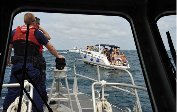 Coast Guard Sector San Diego boarding team members terminate an illegal charter operating in the vicinity of the USS Midway in the San Diego bay, on Oct. 6, 2023. U.S Coast Guard photo.