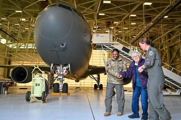 First Lt. Micala Bruce, 349th Air Refueling Squadron pilot, and Lt Col. Kristen Smith, 349th ARS director of operations, walk with WWII veteran Katie Conkling at McConnell Air Force Base, Kan., Jan. 18, 2024. Conkling celebrated her 103rd birthday with a tour of the base and the inside of KC-46A Pegasus. (U.S. Air Force Photo by Airman 1st Class Gavin Hameed) 