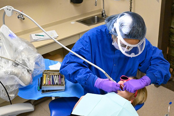 Senior Airman Mikhaela Maglaque, 28th Medical Group dental technician, cleans a child’s teeth during a Children’s Dental Day event at Ellsworth Air Force Base, S.D., March 10, 2023. During the event, the medical group's dental clinic provided free services for children of military service members at the installation. (U.S. Air Force photo by Airman 1st Class Dylan Maher)