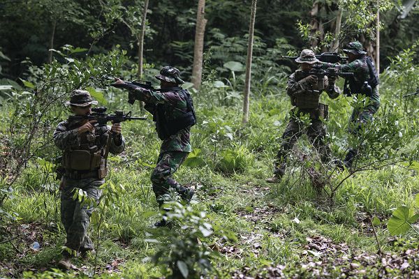 U.S. Marines with 1st Battalion, 7th Marines, attached to Marine Rotational Force-Southeast Asia, and Indonesian marines with 4th Marine Infantry Brigade, Pasmar 1, conduct a period of instruction on military operations in urban terrain during Keris Marine Exercise 2023 at Piabung Training Area in Sukabumi, West Java, Indonesia, Nov. 27, 2023. Keris MAREX is a bilateral exercise led by the U.S. Marine Corps and the Indonesian Marine Corps, or Korps Marinir, to promote military interoperability and maritime domain awareness capabilities, strengthen relationships, and expand military capabilities among participating forces in the advancement of a Free and Open Indo-Pacific. MRF-SEA is a Marine Corps Forces Pacific operational model that involves exchanges with subject matter experts, promotes security goals with Allies and Partners, and positions I MEF forces west of the International Date Line. (U.S. Marine Corps photo by Sgt. Shaina Jupiter)