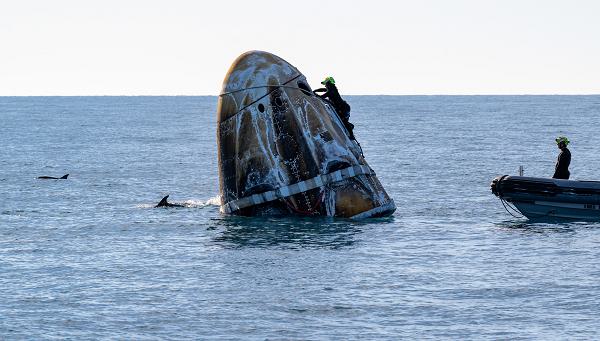 Support teams work around a SpaceX Dragon spacecraft shortly after it landed with NASA astronaut and Space Force Col. Nick Hague, as well as fellow astronauts Suni Williams and Butch Wilmore, and Roscosmos cosmonaut Aleksandr Gorbunov aboard in the water off the coast of Tallahassee, Fla., Tuesday, March 18, 2025.Hague’s flight marked a significant moment in the history of the Space Force, as he became the first active-duty Guardian to fly to space and one of the first humans to launch from Space Launch Complex 40 at Cape Canaveral Space Force Station, Fla. He traveled 72,553,920 miles during his mission, spent 171 days in space, and completed 2,736 orbits around Earth. Hague has logged 374 days in space over his two missions. (U.S. Air Force photo courtesy of NASA by Keegan Barber)