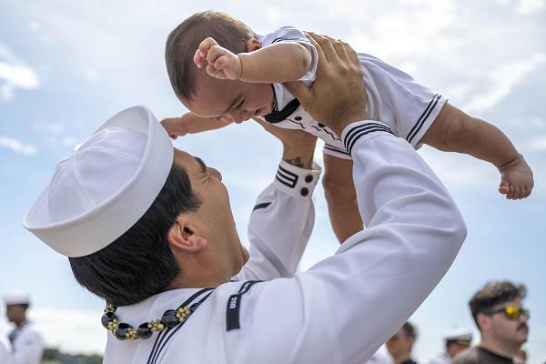 250316-N-EI510-1456 Joint Base Pearl Harbor-Hickam, Hawaii, March 16, 2025. Machinist's Mate, Nuclear Power, 2nd Class Chris Gailiatabarez plays with his son after the Virginia-class fast-attack submarine USS Vermont (SSN 792) returned to Joint Base Pearl Harbor-Hickam, Hawaii following a scheduled deployment, March 16, 2025. Vermont is the third U.S. Navy ship named after the Green Mountain State. Vermont was administratively commissioned in April 2020 and is the first Block IV Virginia-class fast-attack submarine. (U.S. Navy photo by Mass Communication Specialist 1st Class Scott Barnes)