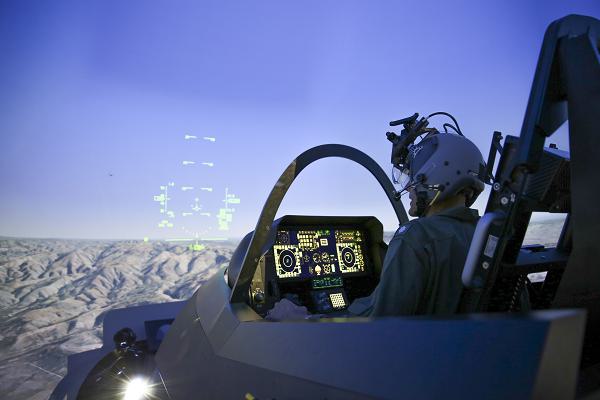 A pilot trains in the Joint Simulation Environment (JSE) at the Naval Air Warfare Center Aircraft Division in Patuxent River, Md. Tactical pilots from the Marine Corps and Air Force conducted the first-ever joint training exercise flying simulated combat missions together in F-35 and F-22 fifth-generation fighter jets in the JSE on March 24-27, 2024. (U.S. Navy photo by Terri Thomas)