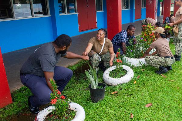 SUVA, Fiji (May 8, 2025) – Culinary Specialist 2nd Class Kadeeja Howard, from Waycross, Georgia, assigned to the U.S. 7th Fleet flagship USS Blue Ridge (LCC 19) and Republic of Fiji Navy Ordinary Seaman Nadidi Taginaselala, work together during  a joint beautification project during a scheduled port visit in Suva, Fiji, May 8, 2025. The Blue Ridge and embarked U.S. 7th Fleet staff conduct regular Indo-Pacific patrols to deter aggression, strengthen alliances and partnerships, and advance future warfighting capabilities. (U.S. Navy photo by Mass Communication Specialist Seaman Alajia Williams)
