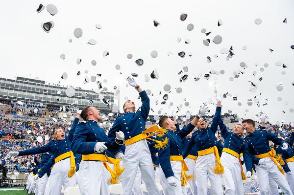 The U.S. Air Force Academy Class of 2025 graduates toss their hats skyward at Falcon Stadium in Colorado Springs, Colo., May 29, 2025. Nine hundred nine cadets received their commissions as second lieutenants in the Air Force and Space Force. (U.S. Air Force photo by Dylan Smith) 