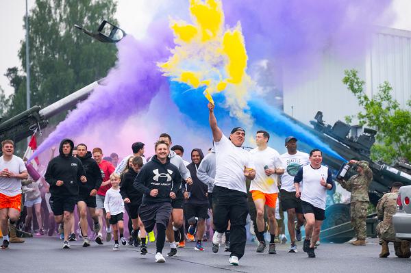 U.S. Soldiers assigned to 2nd Cavalry Regiment and their families begin the family color run at Rose Barracks, U.S. Army Garrison Bavaria, Vilseck, Germany, May 22, 2025. On the final day of Dragoon Week 25, 2CR increased unit cohesion and pride through a fun, family welcoming event. Held annually, Dragoon Week celebrates the proud heritage and enduring readiness of 2CR, the U.S. Army’s longest continuously serving cavalry regiment. Through physical competitions, tactical challenges, and community engagement, 2CR reaffirms its commitment to being “Forged for War.” (U.S. Army photo by Spc. Elijah Magana)