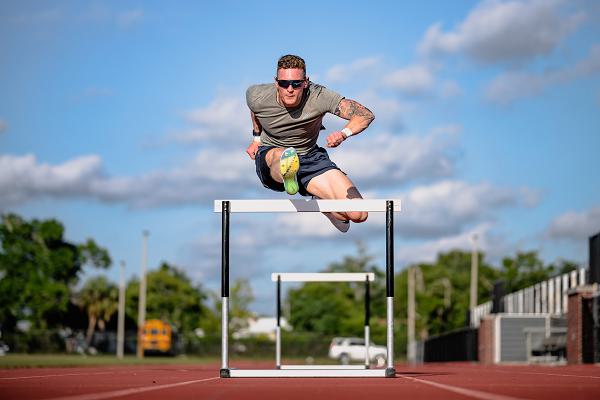 Second Lt. Braeden Holcombe, 325th Civil Engineer Squadron engineering project programmer, hurdles in Panama City, Fla., May 13, 2025. Holcombe is a member of the World Class Athlete Program, a Department of the Air Force initiative that allows active-duty Airmen and Guardians to train and compete at the highest levels of international sports while continuing to serve. (U.S. Air Force photo by Airman 1st Class Zeeshan Naeem) 