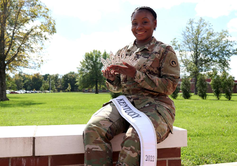 Master Sgt. Diana Layne, executive assistant to the command sergeant major, 1st Theater Sustainment Command, celebrates being chosen as United States of America Ms. Kentucky 2022 at Fort Knox, Kentucky, Oct. 12, 2021. (U.S. Army photo by Sgt. Owen Thez)