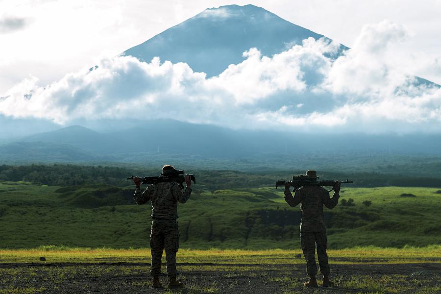 U.S. Marines with Marine Wing Support Squadron (MWSS) 171, observe the range prior to conducting training in front of Mt. Fuji with M240B machine guns during exercise Eagle Wrath 21 at Combined Arms Training Center (CATC) Camp Fuji, Japan, July 16, 2021. Eagle Wrath is an annual MWSS-171 exercise at CATC Camp Fuji, Japan, designed to increase squadron proficiency in conducting real-world contingency missions while in a forward operating environment. (photo by Lance Cpl. Justin J. Marty)