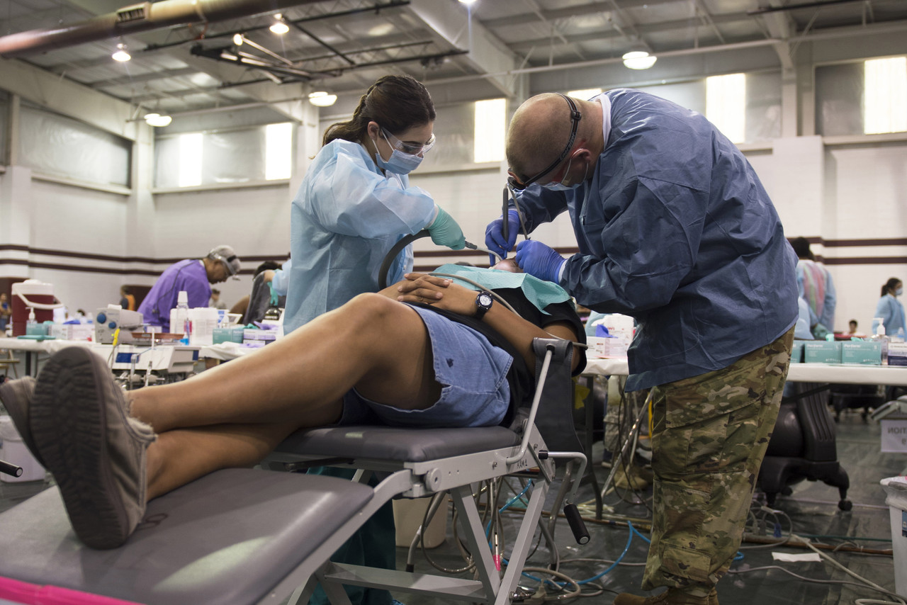 Army Reservists and National Guardsmen dentists and dental assistants work alongside a U.S. Public Health Service personnel in Pharr, Texas during a free dental clinic as part of Operation Lone Star, an annual medical disaster preparedness exercise, July 27, 2016. Photo By: Texas Army National Guard Sgt. 1st Class Malcolm McClendon