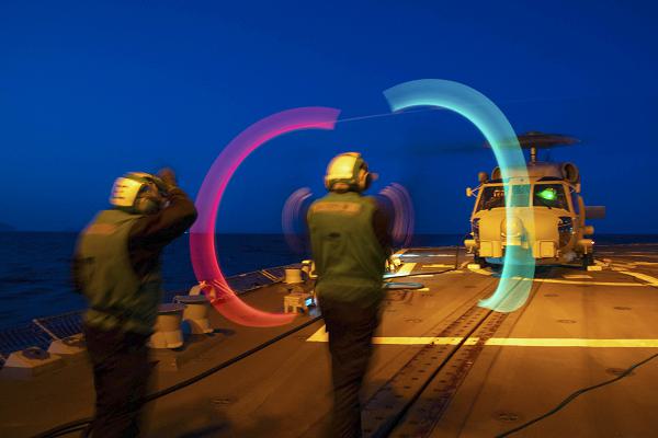 (Mar. 4, 2024) Airman Apprentice Tara Reed, assigned to the Arleigh Burke-class guided-missile destroyer USS Paul Ignatius (DDG 117), directs an aircraft during flight quarters, Mar. 4, 2024. Paul Ignatius is on a scheduled deployment in the U.S. Naval Forces Europe area of operations, employed by the U.S. 6th Fleet to defend U.S., allied and partner interests. (U.S. Navy photo by Mass Communication Specialist 2nd Class Jahlena Riveraroyer)