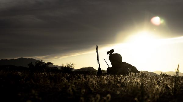 U.S. Marine Corps Lance Cpl Elijah Scott, a Tupelo, Mississippi native, air traffic control navigational aids technician assigned to Marine Aviation Weapons and Tactics Squadron One, listens to a radio during an expeditionary air traffic control exercise as part of Weapons and Tactics Instructors course 2-24, at Hawk Eye, Arizona, March 28, 2024. WTI is an advanced graduate-level course that provides advanced tactical training to enhance and employ advanced aviation weapons and tactics. (U.S. Marine Corps photo by Cpl Tyler M. Raab)  