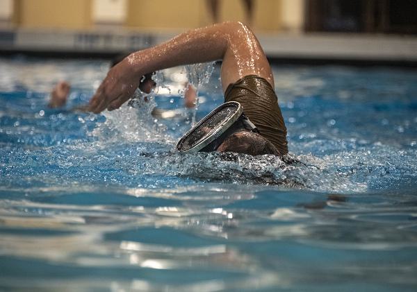 An Airman training to be a survival, evasion, resistance and escape specialist participates in water training during a relay swimming exercise March 29, 2024, at Fairchild Air Force Base, Wash. SERE specialists must be prepared to act and survive in various environments, including the open ocean and other bodies of water. (U.S. Air Force photo by Senior Airman Nicholas Rupiper) 