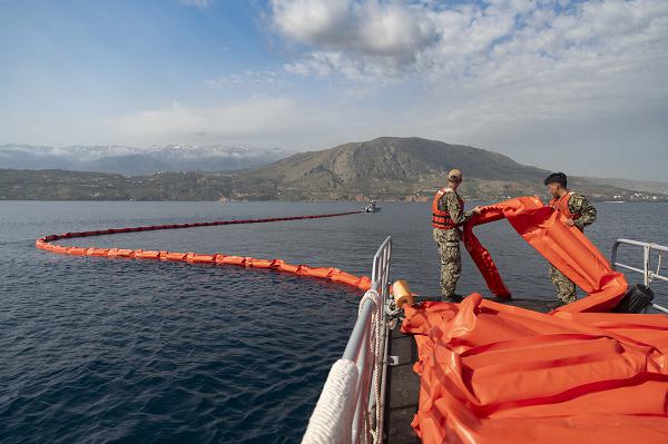 NAVAL SUPPORT ACTIVITY SOUDA BAY, Greece (April 19, 2024)Boatswain’s Mate 2nd Class Sean Sweetay and Boatswain’s Mate Seaman Apprentice Tencing Wang Po, both assigned to Naval Support Activity (NSA) Souda Bay, practice deploying an oil boom during an oil spill prevention and response training exercise at the NATO Marathi Pier Complex on April 19, 2024. NSA Souda Bay is an operational ashore installation that enables and supports U.S., Allied, Coalition, and partner nation forces to preserve security and stability in the European, African, and Central Command areas of responsibility. (U.S. Navy photo by Mass Communication Specialist 1st Class Delaney S. Jensen)