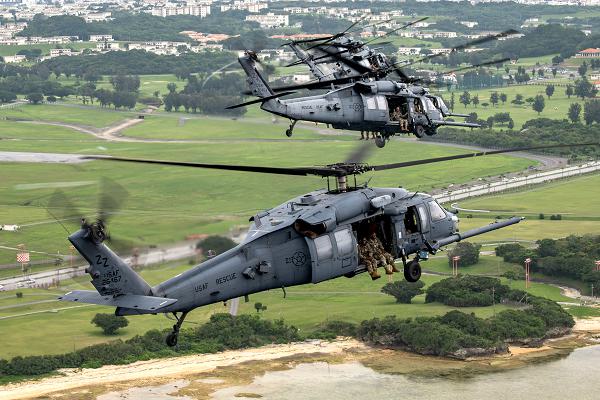 U.S. Air Force HH-60G Pave Hawks assigned to the 33rd Rescue Squadron fly in formation over Kadena Air Base, Japan, April 16, 2024. The Pave Hawk is a highly modified version of the Army Black Hawk helicopter which features upgraded communications and navigation suite along with automatic flight control system, night vision goggles, color weather radar and an engine/rotor blade anti-ice system. (U.S. Air Force photo by Staff Sgt. Jessi Roth) 