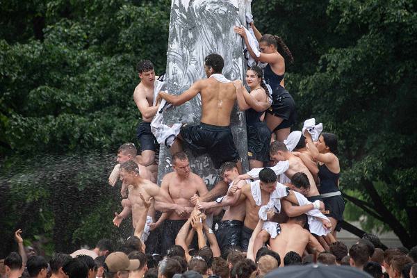 ANNAPOLIS, Md. (May 15, 2024) U.S. Naval Academy freshmen, or plebes, climb the Herndon monument, a tradition symbolizing the successful completion of the midshipmen’s freshman year. The class of 2027 completed the climb in 2 hours, 19 minutes and 11 seconds. As the undergraduate college of our country’s naval service, the Naval Academy prepares young men and women to become professional officers of competence, character, and compassion in the U.S. Navy and Marine Corps. (U.S. Navy photo by Stacy Godfrey)