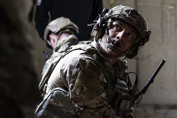 Tech Sgt. Gabriel Pillcurima, a joint terminal attack controller assigned to Detachment 1, 3rd Air Support Operations Squadron, listens to guidance from a Tactical Combat Casualty Care - Tier 2 instructor during a TCCC - Tier 2 training exercise at Camp Mad Bull, Joint Base Elmendorf-Richardson, Alaska, May 10, 2024. TCCC - Tier 2 is a 40-hour course for personnel who may need to deploy in support of combat operations that teaches students how to provide life-saving techniques and provide trauma care in combat situations. (U.S. Air Force photo by Senior Airman Julia Lebens) 
