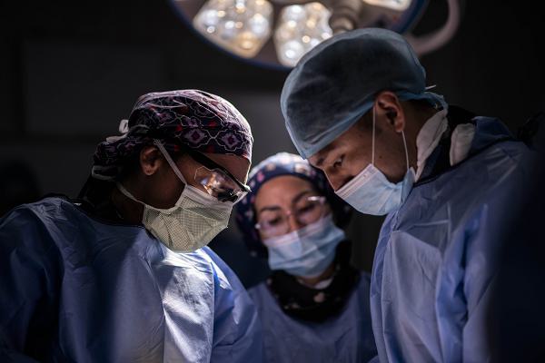 U.S. Air Force Lt. Col. Kim Broughton, 96th Surgical Squadron orthopedic surgeon, left, conducts surgery on a leg alongside Peruvian surgeons at Hospital Nacional Dos de Mayo in Lima, Peru, as part of exercise Resolute Sentinel 2024, June 10, 2024. Throughout the exercise, U.S. Air Force surgeons performed several procedures to include a wrist fusion, knee and hip replacements, fracture surgeries, and a partial foot amputation. This combined, joint force exercise focuses on building strong partnerships with partner-nation militaries so the nations are always ready to work together, whatever challenges they may face. (U.S. Air Force photo by Tech. Sgt. Devin Boyer)