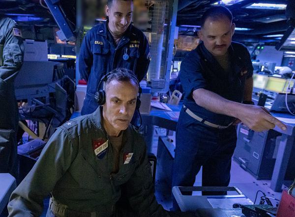 PHILIPPINE SEA (June 11, 2024) Rear Adm. Greg Newkirk, left, commander of Task Force 70 and Carrier Strike Group 5, and Cmdr. Stephen Szachta,  commanding officer of the Arleigh Burke-class guided-missile destroyer USS Rafael Peralta (DDG 115), work at a console in the combat information center aboard the ship during Valiant Shield 2024. Exercises such as Valiant Shield allow the Indo-Pacific Command Joint Forces the opportunity to integrate forces from all branches of service and with our allies to conduct precise, lethal, and overwhelming multi-axis, multi-domain effects that demonstrate the strength and versatility of the Joint Force and our commitment to a free and open Indo-Pacific. (U.S. Navy photo by Mass Communication Specialist 1st Class Devin Monroe)        