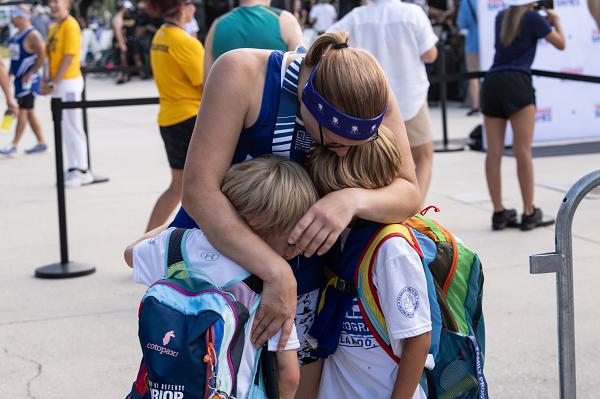 TSgt Jessica Derhammer (ret) participating in track during the 2024 Warrior Games. Derhammer celebrating with her children after medaling.The Department of Defense Warrior Games is a Paralympic-style event used to showcase the power of adaptive sports as part of the recovery process for wounded, ill or injured servicemembers. The US Olympic Committee hosted the Warrior Games from 2010 to 2014 in Colorado Springs, Colorado. DoD began hosting the games in 2015, with the US Marine Corps hosting that year at Quantico, Virginia. (US Air Force Photo by Anthony Beauchamp)