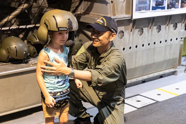 Visitors tour the Japanese Maritime Self-Defense Force Ōsumi-class amphibious transport dock ship JS Kunisaki (LST 4003) during Open Ship Day amid Exercise Rim of the Pacific (RIMPAC) 2024 while in port at Joint Base Pearl Harbor-Hickam, Hawaii, July 6. Twenty-nine nations, 40 surface ships, three submarines, 14 national land forces, more than 150 aircraft and 25,000 personnel are participating in RIMPAC in and around the Hawaiian Islands, June 27 to Aug. 1. The world's largest international maritime exercise, RIMPAC provides a unique training opportunity while fostering and sustaining cooperative relationships among participants critical to ensuring the safety of sea lanes and security on the world's oceans. RIMPAC 2024 is the 29th exercise in the series that began in 1971. (U.S. Navy photo by Mass Communication Specialist 2nd Class Ryan LeCompte)