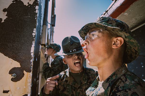 U.S. Marine Corps Sgt. Alberto Ochoa, a drill instructor with Fox Company, 2nd Recruit Training Battalion, corrects a recruit during the table one course of fire at Marine Corps Base Camp Pendleton, California, Aug. 21, 2024. The table one course of fire is designed to introduce recruits to the basic fundamentals of marksmanship and rifle safety. (U.S. Marine Corps photo by Cpl. Sarah M. Grawcock)