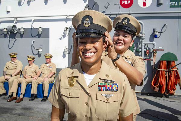 Chief Master-at-Arms Krystal JonesBostic, assigned to the Wasp-class amphibious assault ship USS Boxer (LHD 4), a native of Detroit, receives her combination cover during the FY25 chief petty officer pinning ceremony as the ship steams in the Pacific Ocean, Sept. 26, 2024. Boxer and embarked elements of the 15th Marine Expeditionary Unit are conducting routine operations in the U.S. 7th Fleet area of operations. U.S. 7th Fleet is the U.S. Navy’s largest forward-deployed numbered fleet, and routinely interacts and operates with allies and partners in preserving a free and open Indo-Pacific region. (U.S. Navy photo by Mass Communication Specialist 2nd Class Connor Burns)