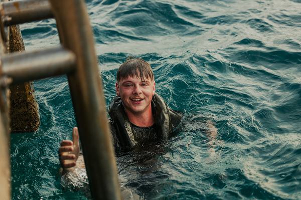 U.S. Marine Corps Cpl. Timothy Phelps Jr., an infantry rifleman with Golf Company, 2d Battalion, 2d Marine Regiment, 2d Marine Division, conducts a 200-meter swim test during Tres Kolos 24 on Camp Savaneta, Aruba, Oct. 15, 2024. U.S. Marines with 2/2 conducted a deployment for training to Aruba to conduct small-unit training while building camaraderie with the Royal Netherlands Marine Corps, a NATO ally and routine training partner. (U.S. Marine Corps photo by Cpl. Antonino Mazzamuto)