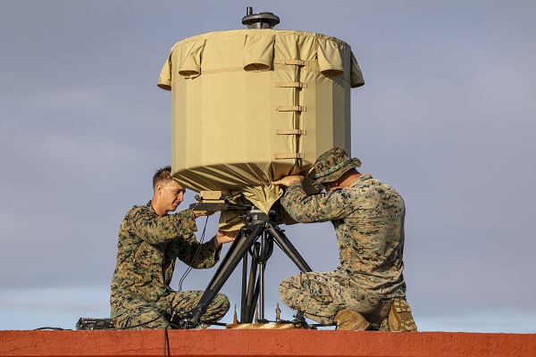 U.S. Marine Corps Cpl. Jonathan F. Mikita, left, a sensor support Marine and Sgt. Michael J. Tatay, an artillery electronics technician, both with 3rd Battalion, 12th Marine Littoral Regiment, 3d Marine Division, assemble a Lightweight Counter-Mortar Radar system during exercise Keen Sword 25 at U.S. Marine Corps Training Facility Ie Shima, Okinawa, Japan, Oct. 27, 2024. The LC-MR allows for rehearsals and coordination of close air support and fires. Keen Sword is a biennial, joint and bilateral field-training exercise involving U.S. military and Japan Self-Defense Force personnel, designed to increase readiness and interoperability while strengthening the ironclad U.S.-Japan alliance. (U.S. Marine Corps photo by Staff Sgt. Robert Gavaldon)