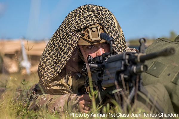SupportOurTroops.Org - On the Radar: Tinian, Northern Mariana Islands, February 26, 2018 -- Air Force Airman 1st Class Janine Lieder defends a position during a helicopter expedient refuel system setup during exercise Cope North 2018.   Lieder is assigned to the 736th Security Forces Squadron's Fly-Away Security Team. Photo by Airman 1st Class Juan Torres Chardon