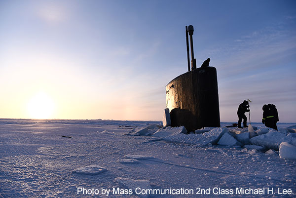 Beaufort Sea, March 11, 2018 -  A field team from Ice Camp Skate prepares to attach a brow aboard the Los Angeles-class fast-attack submarine USS Hartford (SSN 768) in support of Ice Exercise (ICEX) 2018.  The five-week biennial exercise allows the Navy to assess its operational readiness in the Arctic, increase experience there, advance understanding of the Arctic environment and continue to develop relationships with other services, allies and partner organizations.