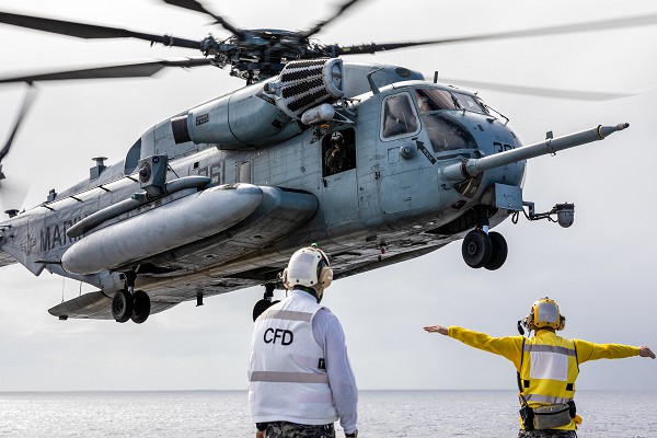 Pacific Ocean. (August 24, 2024): In this photo by Royal Australian Navy Seaman Mathew Lyall, a U.S. Marine Corps helicopter lands aboard the Australian Helicopter Land Dock Ship the HMAS Canberra during flight operations as part of Rim of the Pacific (RIMPAC) exercises. Australian/Chinese relations hit a new low recently over a Defense Technology Agreement with America and Britain to provide nuclear powered submarine technology to Australia